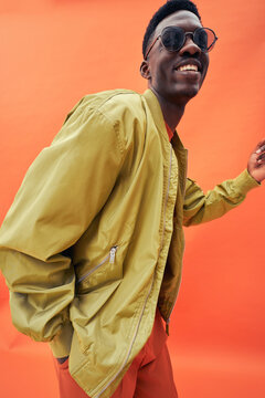 Black fashionable man model in stylish bomber jacket
