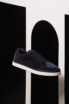 Stylish sneakers showcased against modern backdrop