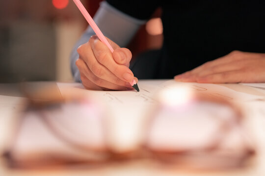 Woman sketching using pencil