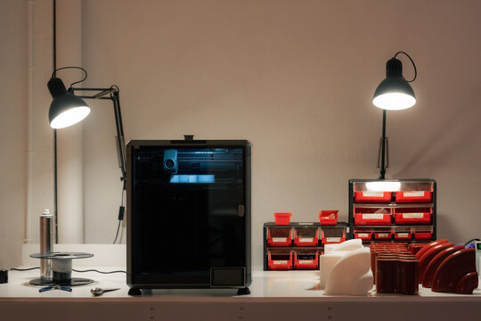 Workspace With 3D Printer and Tools for Creating Objects