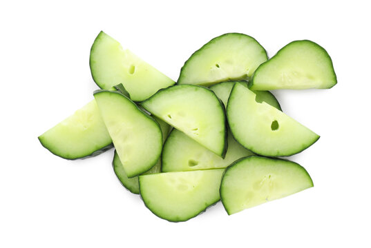 Pieces of fresh cucumbers isolated on white, top view