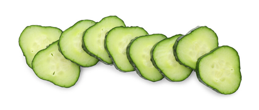 Pieces of fresh cucumbers isolated on white, top view