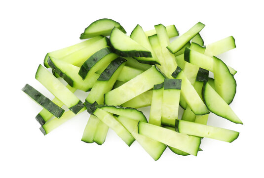 Pieces of fresh cucumbers isolated on white, top view