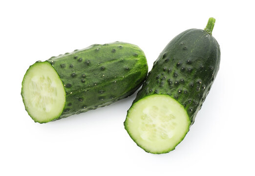 Halves of fresh ripe cucumber isolated on white