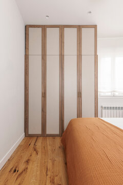 Fitted wardrobe with fabric panels
