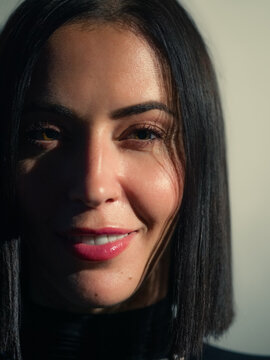 Woman With Dark Bob Hair Smiles in a Closeup Shot