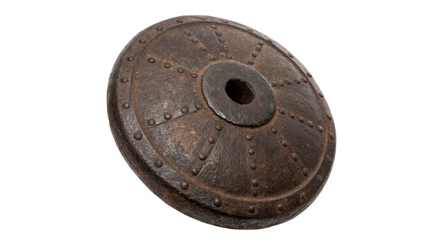 Ancient weathered round metallic shield or textured antique bronze plate decorative element