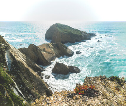 Alteirinhos Beach, Zambujeira do Mar, Costa Vicentina, Alentejo, Portugal: Rugged cliffs and sea stacks along the Atlantic coast