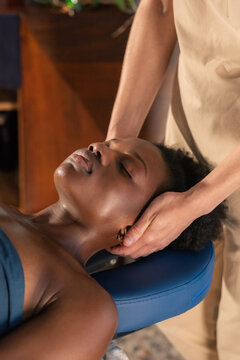 Woman Receives Neck Massage in Wellness Center