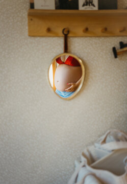 Baby belly in small mirror