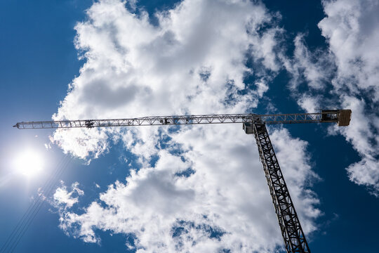 Tower Crane Against Cloudy Sky