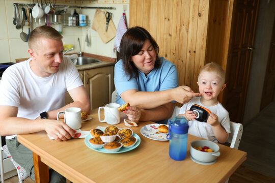 The family is spending time in the kitchen