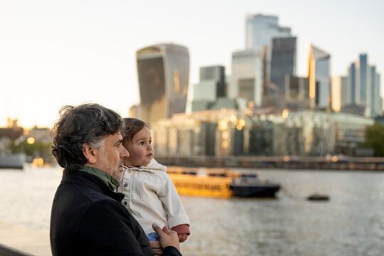 Father And Baby Watching The London Skyline