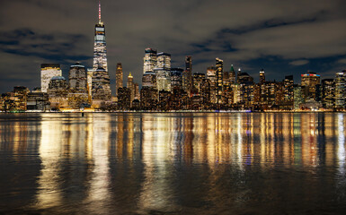Naklejka premium New York Manhattan with Freedom Tower and WTC. New York City night skyline. New York downtown Manhattan panorama at night. New York iconic view.