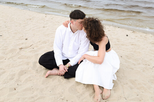 a couple on the riverbank