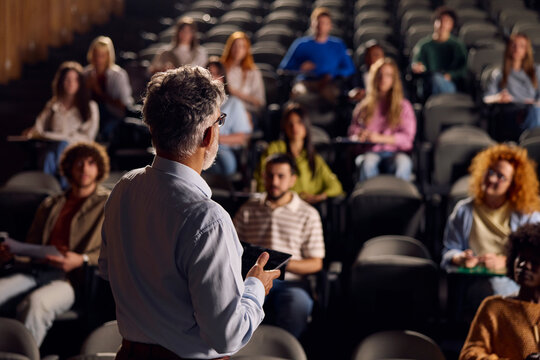 Eminent professor speaks in front of his students