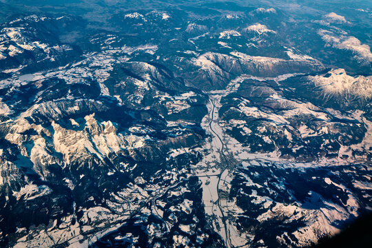 View of snowy mountains from airplane