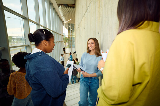Students talking in a modern university building