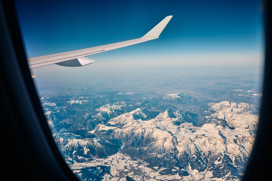 View of mountains through airplane window