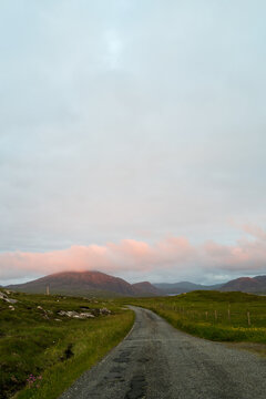 Country road leading to the mountains. Isle of Lewis