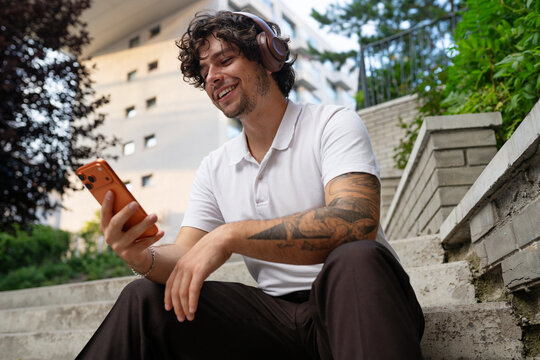 A man uses a mobile phone in the city