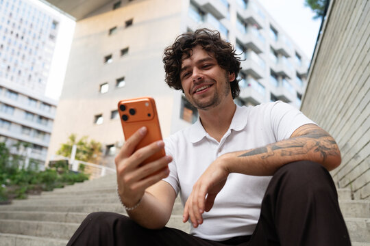 A man uses a mobile phone in the city