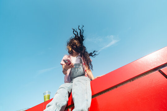 Crazy hair with wind and phone