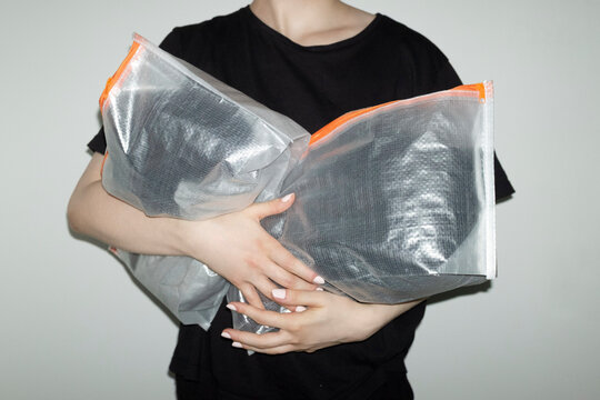Transparent travel plastic packs full of items with flashlight