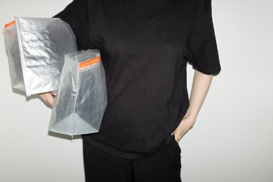 Transparent travel plastic packs full of items with flashlight