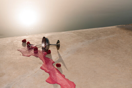 Spilled Raspberry Cocktail By Poolside