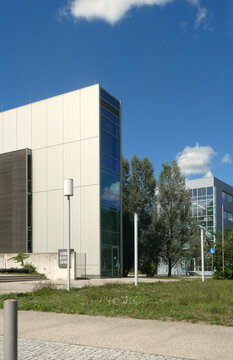 Garching, Bavaria, Germany - 29 August 2026: View of the modern glass and metal architecture of the Leibniz Supercomputing Centre on the Technical University of Munich campus under a clear blue sky.