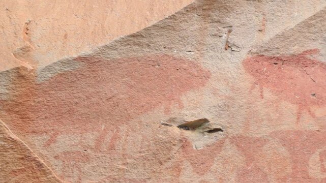Ancient prehistoric cliff rock painting at Pha Taem National Park, Ubon Ratchathani, Thailand.