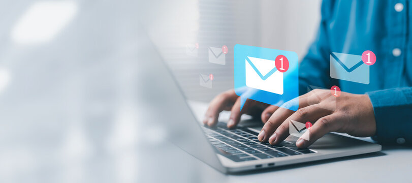 Email notification concept showing a professional using a laptop with digital mail icons and unread alerts, representing communication, inbox management, online messaging, business correspondence,