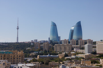 Fototapeta premium Skyline view of modern architecture in Baku, revealing the beauty of the Flame Towers and television tower
