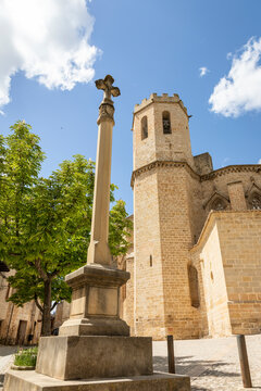 stone pillory with a cross in front of the church of Santa Maria la Mayor in Valderrobres, Comarca of Matarrana, province of Teruel, Aragon, Spain