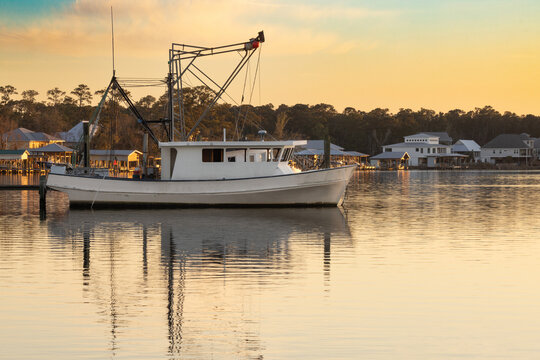 Boats in the Harbor at Gulf Shores Alabama During Sunset With Reflections on the Water