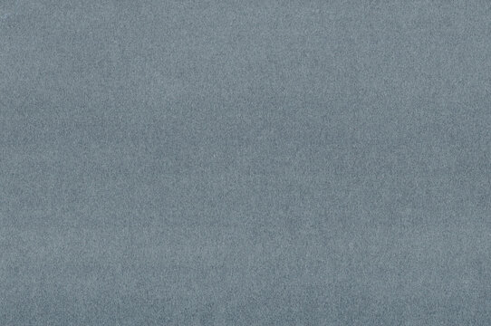 Compact gray handmade paper texture holds an even gray field above dense felted pulp over the paper, offering a firm charcoal surface for charcoal drawing together with ink artwork
