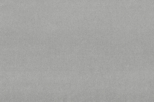Dark gray handmade paper texture spreads an even gray field across a pronounced drawing tooth within the paper field, supporting charcoal drawing and paper collage through rough mottled grain