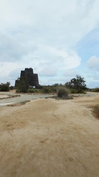Walking toward the Zigurat viewpoint in the Ebro Delta, a popular tourist observation tower near Riumar and the mouth of the Ebro River.