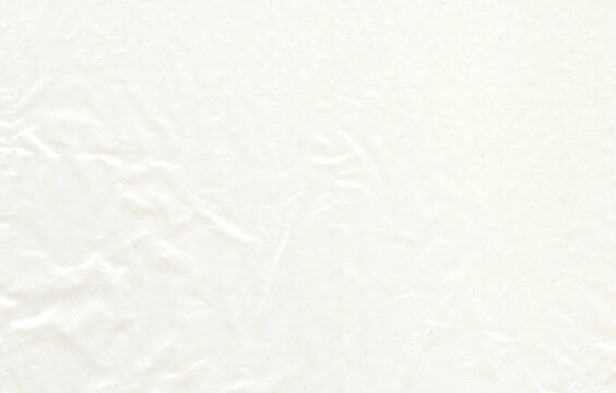 Rippled crumpled translucent paper texture joins a reflective folded surface to angular wrinkle lines over the paper, creating thin translucent layers for paper collage beside translucent overlays