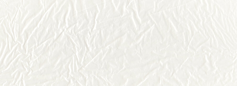 Wrinkled crumpled translucent paper texture joins compressed glossy folds to thin translucent layers over the paper, creating angular wrinkle lines for translucent overlays beside paper collage
