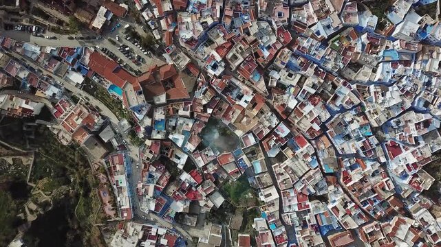 Aerial view of the historic blue-washed buildings and narrow streets of Chefchaouen, Tangier-Tetouan-Al Hoceima, Morocco.