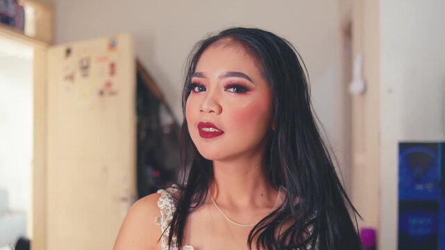 Glamorous Woman Undoes Ponytail, Styles Hair, and Poses Confidently