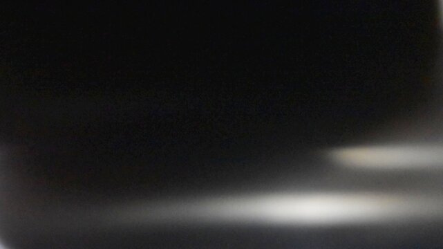 Abstract Dark Background with Soft Low Key Lighting and Subtle Vignette
