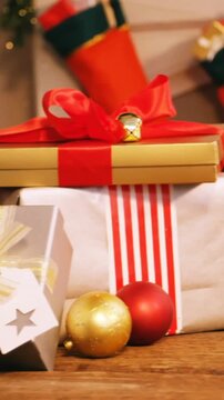 Animation of christmas tree with presents and decorations at home