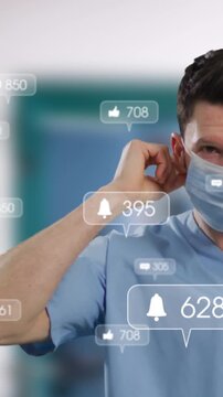 Animation of social media icons on portrait of male health worker wearing surgical mask at hospital