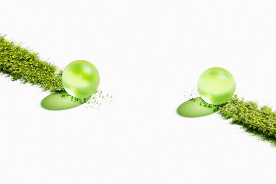 Two glass spheres on diagonal grass strips sustainable energy