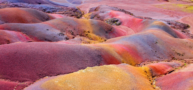 Chamarel Seven Colored Earth Geopark in Mauritius Island. Colorful panoramic landscape about this volcanic geological formation Chamarel Seven Colored Earth Geopark in Riviere noire district.