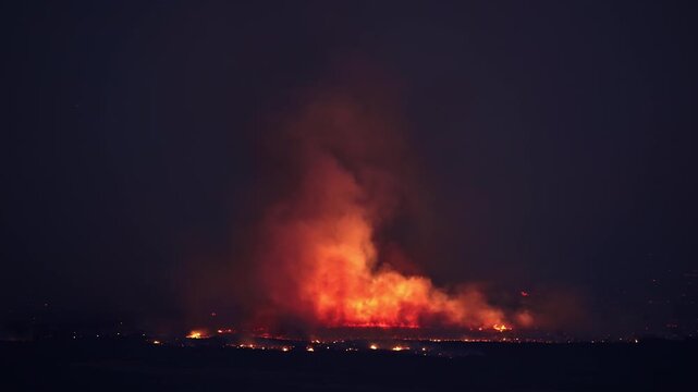 Flames burning at night through the Utah desert during the Tom Creek Fire.