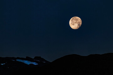 Moon over mountain in Switzerland © Amy